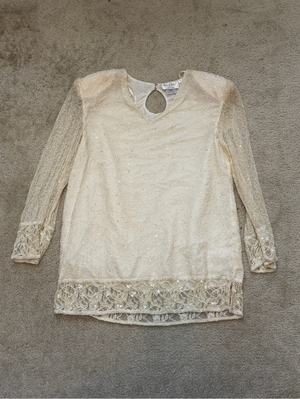 Tan-Chho women’s long-sleeve beaded or sequined blouse/tunic.